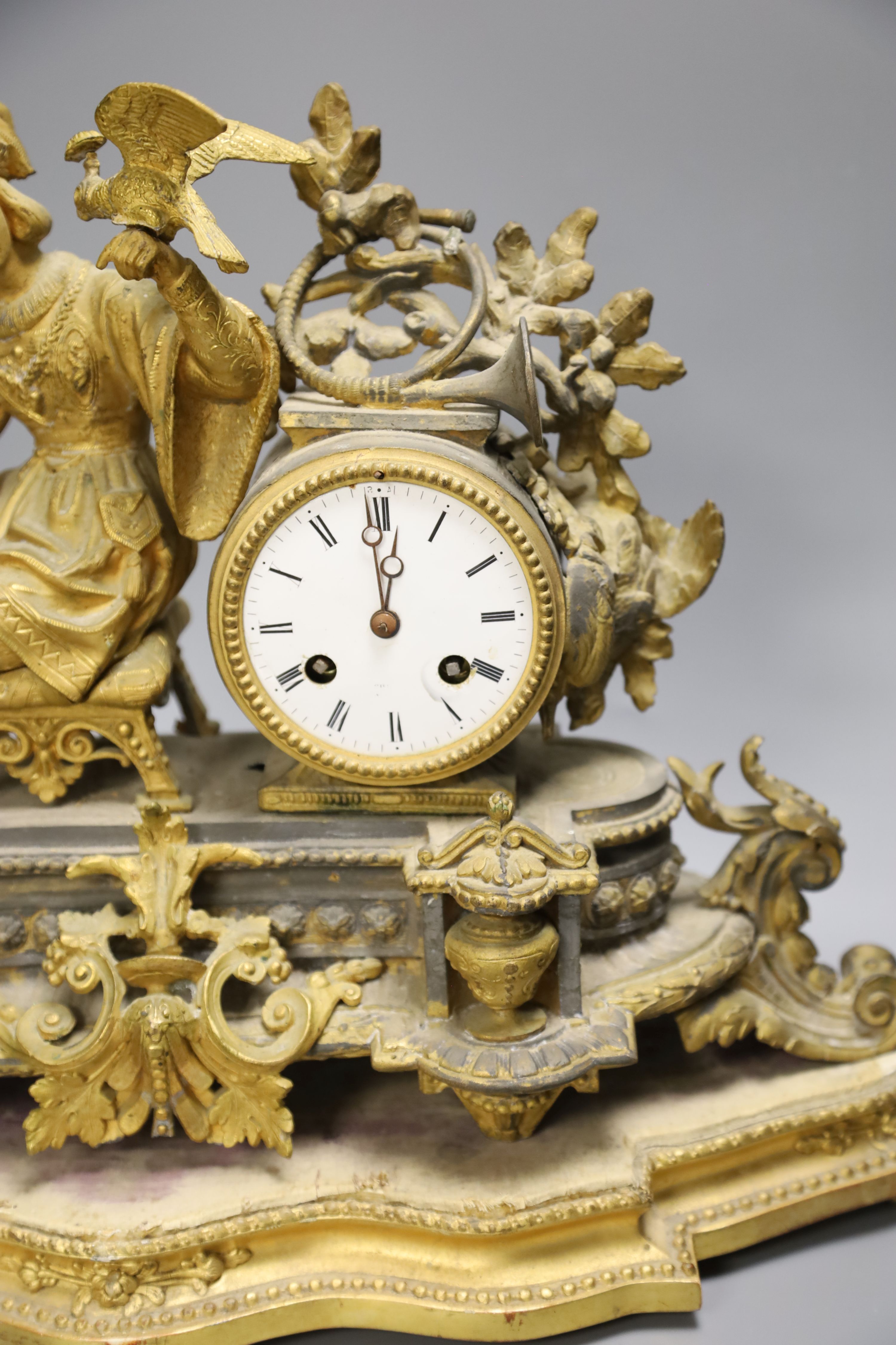 A French gilt metal figural mantel clock and base, overall height 34cm